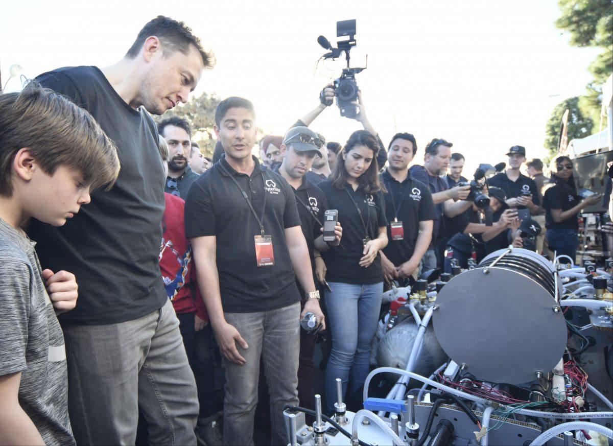 SpaceX CEO Elon Musk checks out the University of California Irvine's HYPERXITE pod during the SpaceX Hyperloop competition in Hawthorne, California on January 29, 2017. (GENE BLEVINS/AFP/Getty Images)