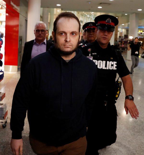 Joshua Boyle walks through the airport after arriving with his wife and three children at Toronto Pearson International Airport, nearly 5 years after he and his wife were abducted in Afghanistan in 2012 by the Taliban-allied Haqqani network, in Toronto, Ontario, Canada, October 13, 2017. (Reuters/Mark Blinch)