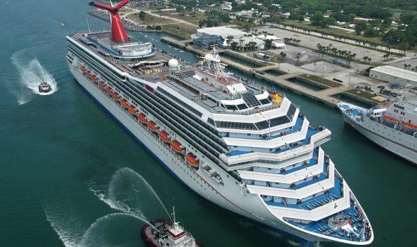 Escorted by water-squirting tugs, the Carnival Glory arrives in Cape Canaveral, Fla., on July 11, 2003. (Andy Newman/Carnival Cruise Lines/HO
