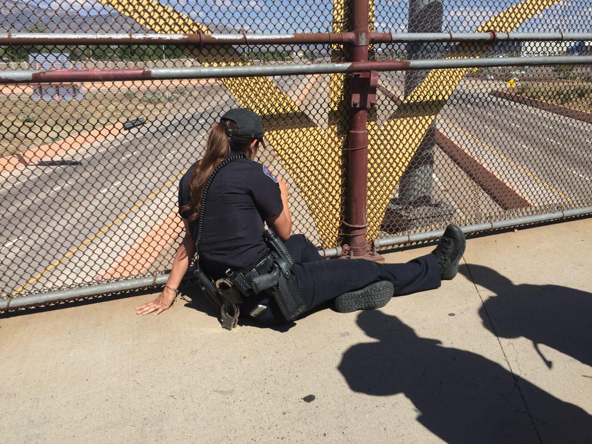 "I tried to stay as calm as I could, but to see someone hanging off a bridge, your stomach does drop, you feel that gut feeling," Madrid said, adding that she first had to try and gain the man's trust. (Albuquerque Police Department)