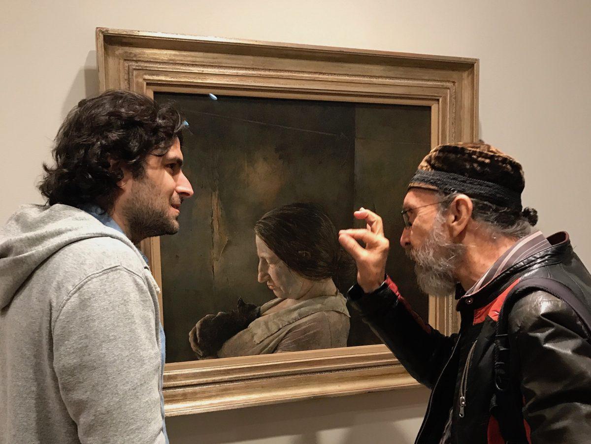 Artists Jordan Sokol (L) and Carlos Madrid talk about Andrew Wyeth's tempera painting technique at the exhibition "Andrew Wyeth: In Retrospect" in the Brandywine River Museum of Art in Chadds Ford, Pennsylvania, on Sept. 2, 2017. (Milene Fernandez/The Epoch Times)