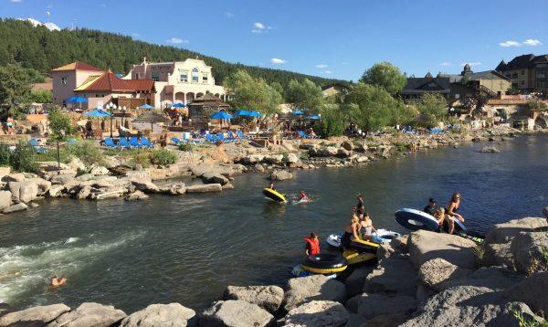 Tubers on the San Juan River in front of the Springs Resort and Spa in Pagosa Springs. (Janna Graber)