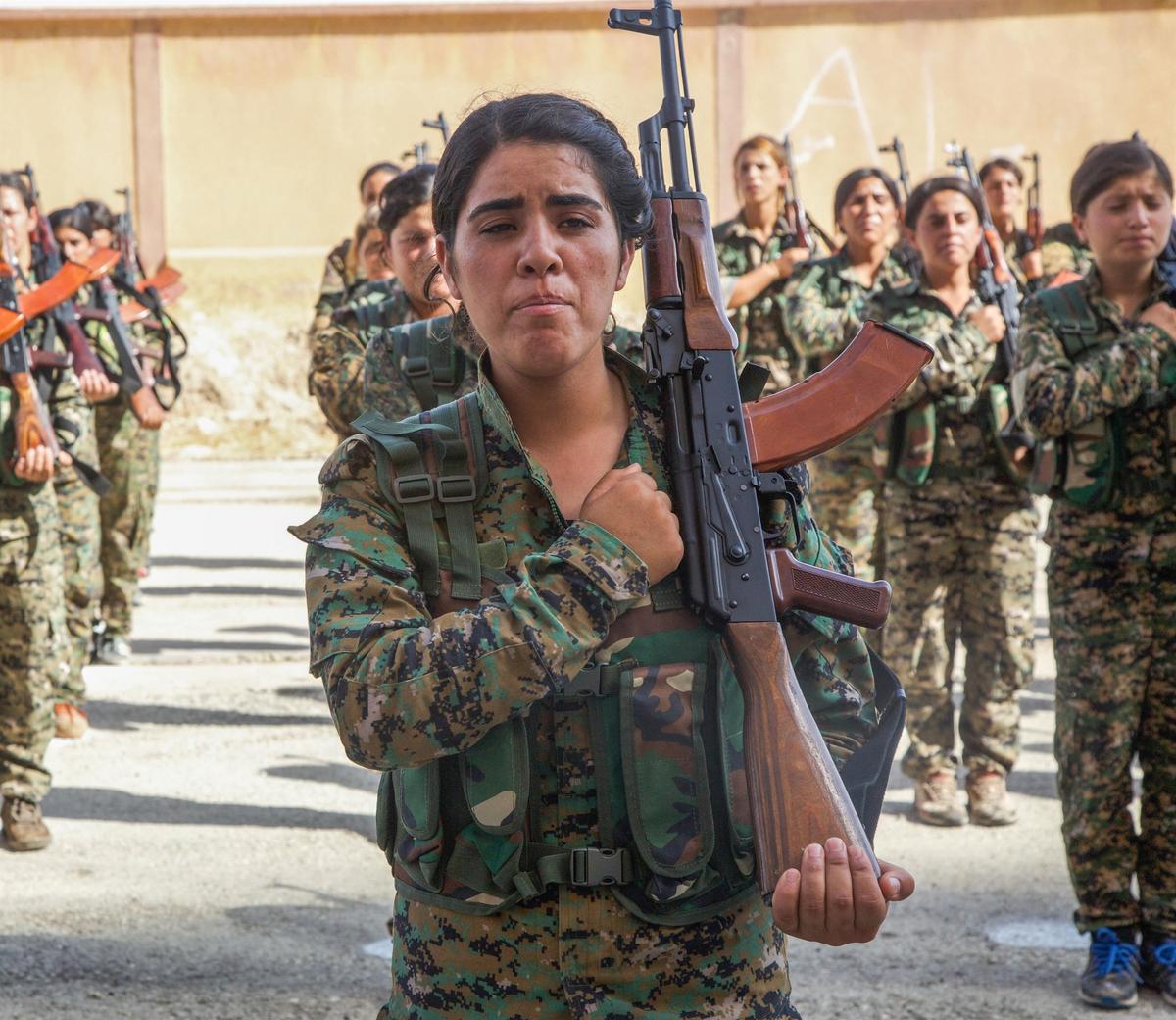 Syrian Democratic Forces trainees, representing an equal amount of Arab and Kurdish volunteers, stand in formation at their graduation ceremony in northern Syria, Aug. 9, 2017. (Army photo by Sgt. Mitchell Ryan)