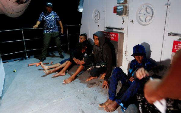Migrants are seen on a boat after they were rescued by Tunisian coast guard off the coast of Bizerte, Tunisia Oct. 12, 2017.(Reuters/Zoubeir Souissi)