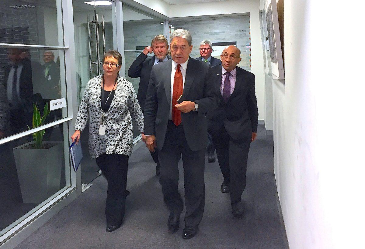 Winston Peters, leader of the New Zealand First Party, walks with officials to a meeting in Wellington, New Zealand, Oct. 8, 2017. (REUTERS/Charlotte Greenfield)