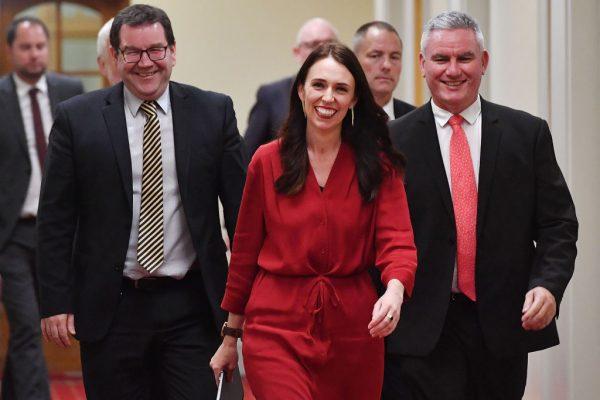New Zealand Prime Minister Jacinda Ardern (C) arrives at a press conference at Parliament in Wellington on Oct. 19, 2017.(MARTY MELVILLE/AFP/Getty Images)