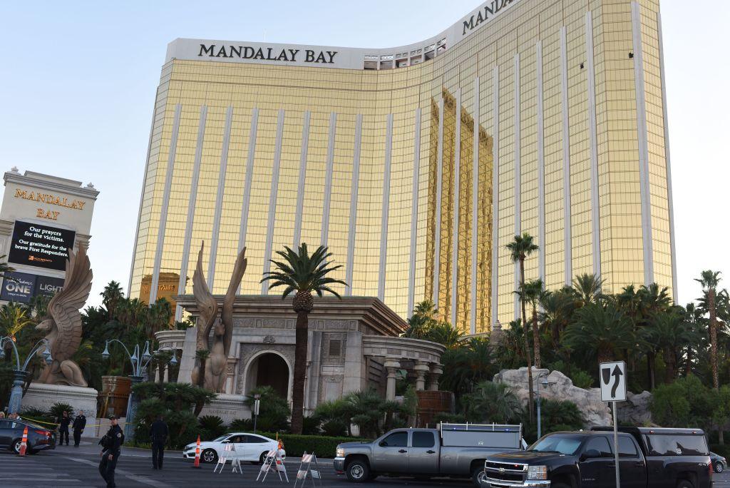 Police stand near the The Mandalay Bay Hotel and Casino in Las Vegas, Nevada, on October 4, 2017 before the windows Stephen Paddock broke for his shooting spree were repaired. A judge has order the hotel to preserve evidence as a civil suit is argued over the hotels alleged negligence. MGM Resorts International has said it will not be renting out the suite. (ROBYN BECK/AFP/Getty Images)