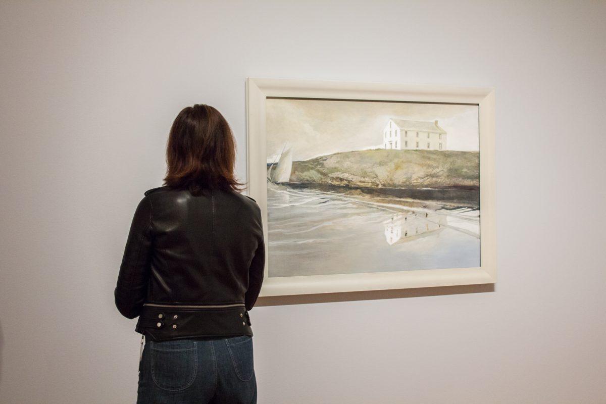 A woman looks at "Goodbye," 2008, by Andrew Wyeth at the "Andrew Wyeth: In Retrospect" exhibition in the Seattle Art Museum on Sept. 20, 2017. (Seattle Art Museum/Natali Wiseman)