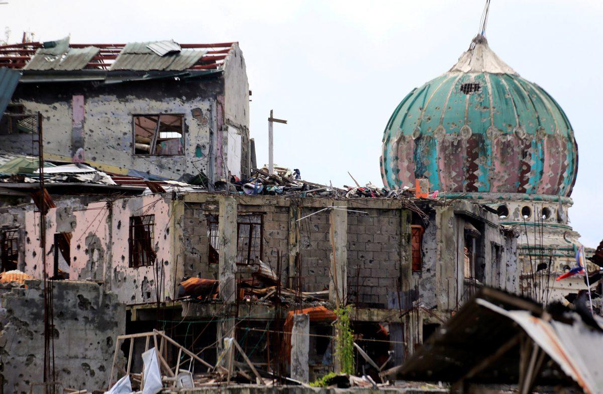 Damaged houses and buildings are seen after government troops cleared the area from pro-ISIS terrorist groups inside the war-torn area in Saduc proper, Marawi city, southern Philippines Oct. 22, 2017.<br/>(Reuters/Romeo Ranoco)