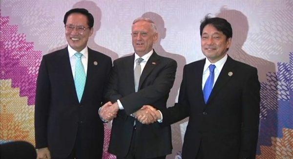 U.S. Defense Secretary Jim Mattis (C) joins hands with his South Korean counterpart Song Young-moo (L) and Japanese counterpart Itsunori Onodera in the Philippines' Clark special economic zone on Oct. 23, 2017. (Video screenshot/Reuters)