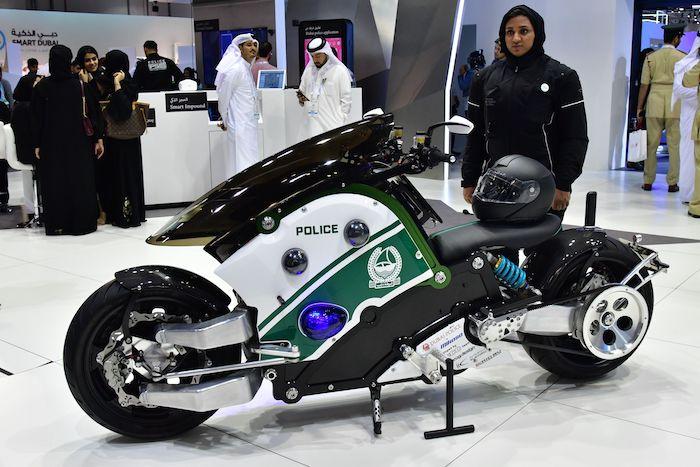 An Emirati police officer stands next to a motorcycle at the Gitex 2017 exhibition at the Dubai World Trade Center in Dubai on Oct. 8, 2017. (Giuseppe Cacace/AFP/Getty Images)