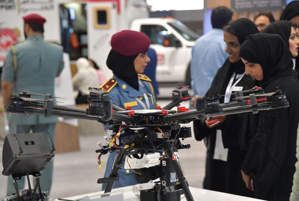 A policewoman stands next to a police drone at the Gitex 2017 technology exhibition. (Giuseppe Cacace/AFP/Getty Images)