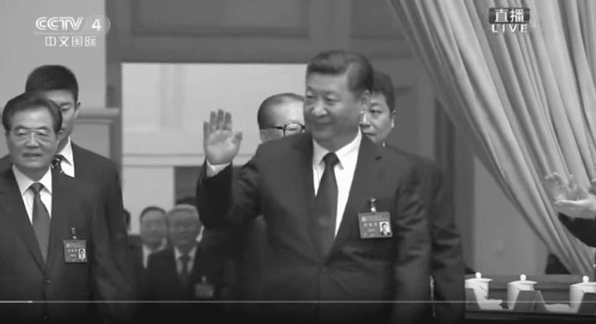 Former CCP leader Jiang Zemin is obscured by Xi Jinping walking in front, during CCTV's broadcast of the 19th National Congress opening session. (Screenshot via YouTube/CCTV)