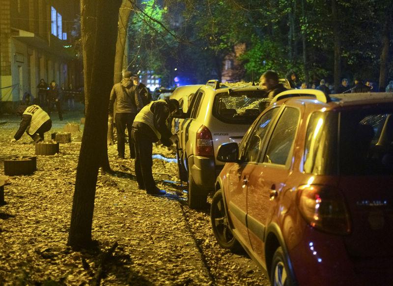 Investigators work at the site of a car explosion in central Kiev, Ukraine Oct. 25, 2017. (REUTERS/Gleb Garanich)