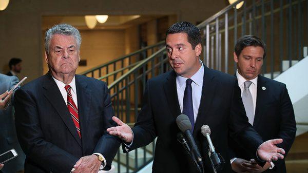 House Intelligence Committee Chairman Devin Nunes (R-Calif.)(C) stands with Rep. Peter King (R-N.Y.), (L) and Rep. Don DeSantis (R-Fla.) as he announces that his committee and the House oversight committee are starting the investigation into Russia and Obama Administration uranium deal. (Mark Wilson/Getty Images)
