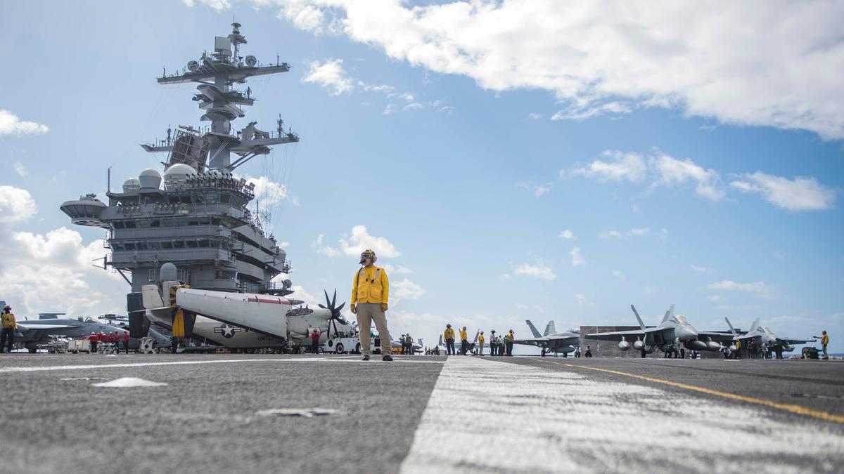 Sailors conduct flight operations on the flight deck of the aircraft carrier USS Theodore Roosevelt (CVN 71). Theodore Roosevelt is currently underway for a regularly scheduled deployment to the U.S. 7th Fleet in support of maritime security operations and theater security cooperation efforts. (Mass Communication Specialist 3rd Class Spencer Roberts)