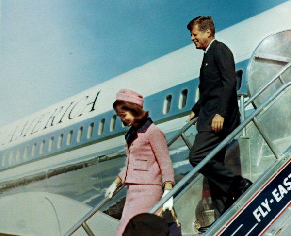President John F. Kennedy and first lady Jacqueline Bouvier Kennedy walk down the steps of Air Force One as they arrive at Love Field in Dallas, Texas less than an hour before his assassination on Nov. 22, 1963. (JFK Library/The White House/Cecil Stoughton/Reuters)