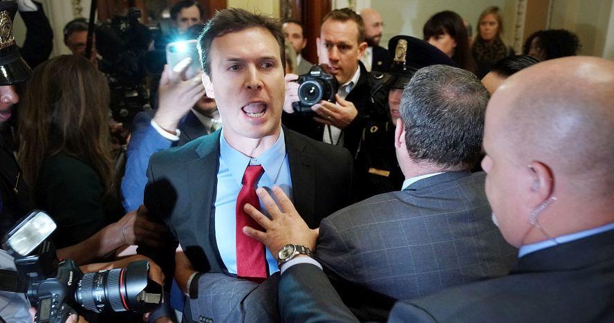 Ryan Clayton of Americans Take Action (C) is corralled by police after he threw Russian flags at Senate Majority Leader Mitch McConnell (R-Ky.) and President Donald Trump as they arrived for the Republican Senate Policy Luncheon at the U.S. Capitol in Washington, DC, on Oct. 24, 2017. Trump joined the senators to talk about upcoming legislation, including the proposed GOP tax cuts and reform. (Photo by Chip Somodevilla/Getty Images)