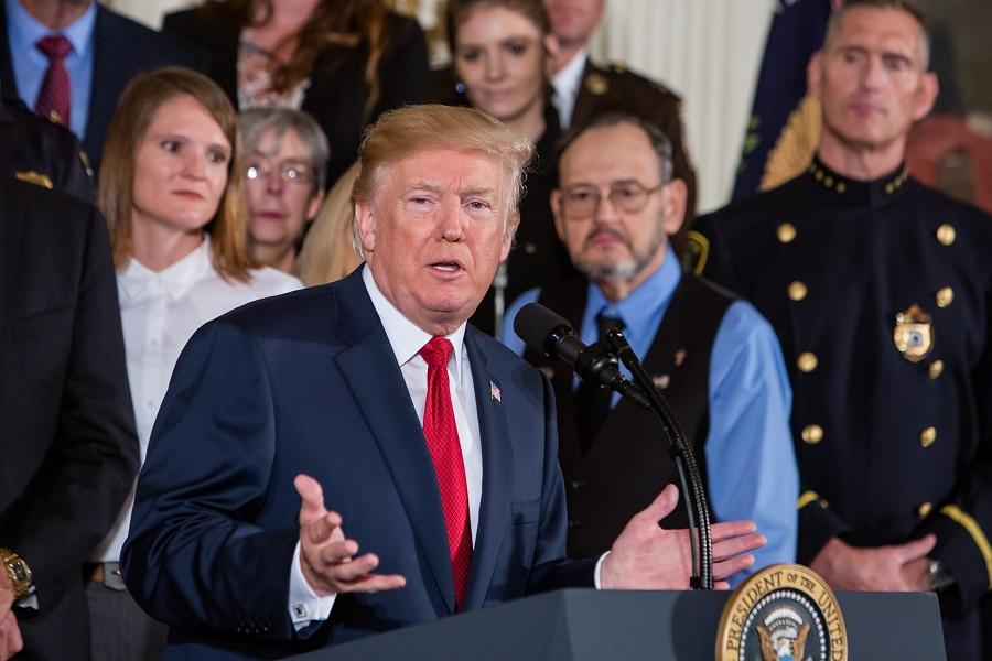 President Donald Trump officially declares the opioid crisis a nationwide public health emergency in the East Room of the White House in Washington on Oct. 26, 2017. (Samira Bouaou/The Epoch Times)