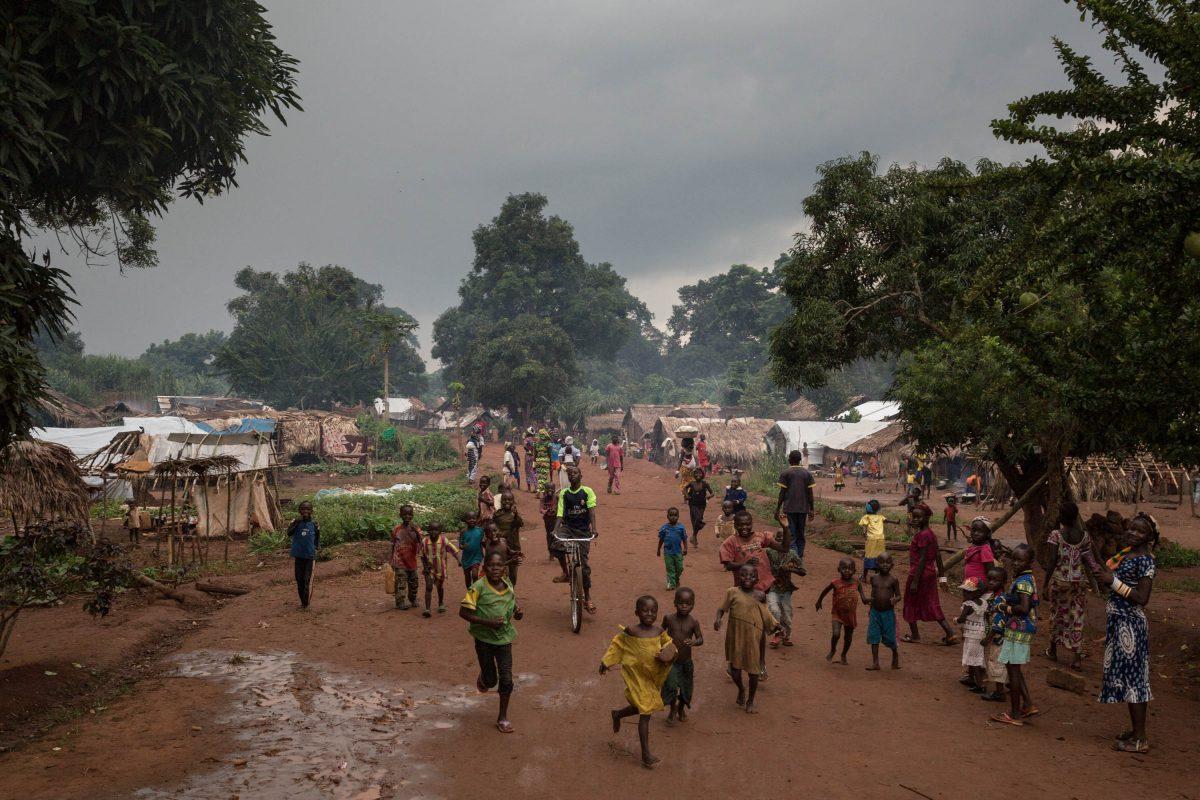 This photograph taken on Aug. 13, 2017, shows Central African refugee children from Bangassou as they run after the car of the bishop of Bangassou, Juan Jose Aguirre, at a refugee site in Ndu, Democratic Republic of Congo. On 13 May 2017, dozens of anti-Balaka fighters stormed the city of Bangassou. They killed dozens of Muslim civilians. Since then, the administration and a large number of residents have fled the city. UN Secretary General Antonio Guterres arrived in the Central African Republic on Oct. 24, 2017 to assess the country's fragile security situation as violence between militias threatens to intensify. (ALEXIS HUGUET/AFP/Getty Images)