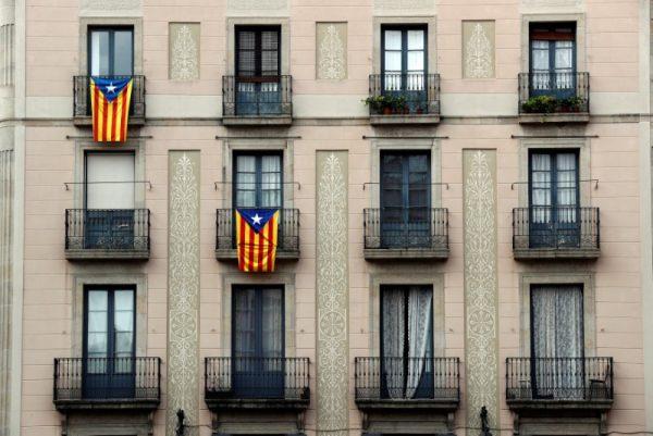 Catalan flags hang from balconies the morning after the Catalan regional parliament declared independence from Spain in Barcelona, Spain, October 28, 2017. (Reuters/Yves Herman)