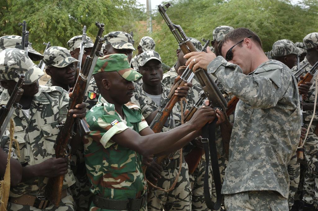 A U.S. Army soldier from the 3rd Special Forces Group helps inspect Malian army weapons in Timbuktu, Mali, on Sept. 4, 2007, during an exercise to foster cooperation among North African nations. (U.S. Air Force photo by Master Sgt. Ken Bergmann)