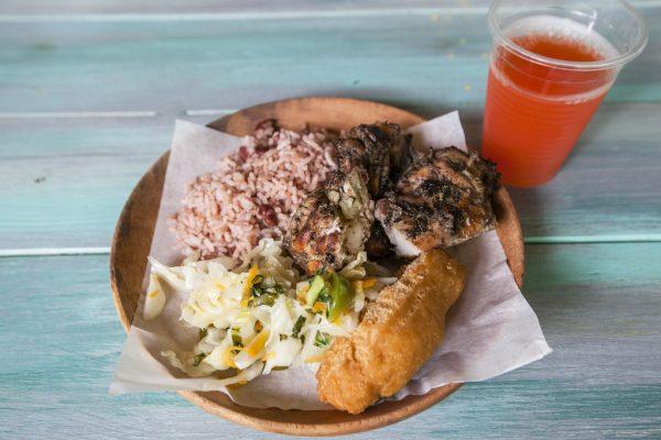 An enticing platter of Jamaican staples: jerk chicken, rice and peas, cabbage, and festivals (fried breads), served at a restaurant inside the Chukka Good Hope adventure park. (Annie Wu/The Epoch Times)