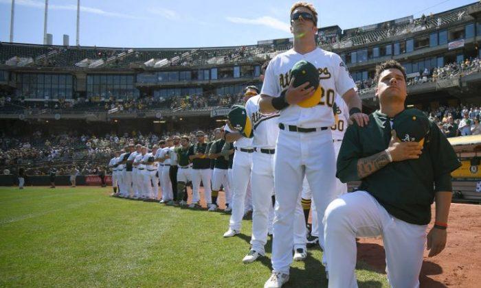 MLB Catcher Who Knelt During Anthem, Is Arrested on Gun Charge
