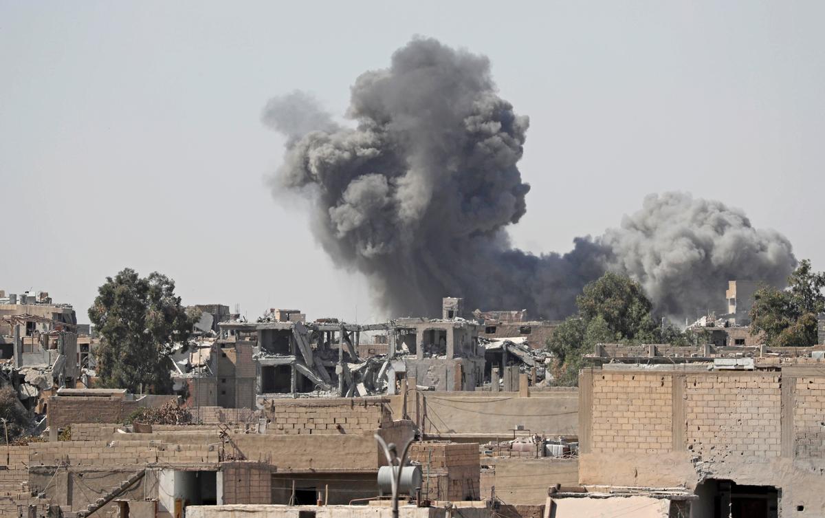 Smoke rises from the positions of the ISIS terrorists after an airstrike by the coalition forces at the front line in Raqqa. (Erik De Castro/Reuters)