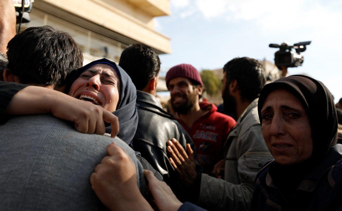 A woman reacts as she hugs one of the hostages who escaped from their ISIS captors in Qaryatayn town in Homs province, Syria Oct. 29, 2017. (REUTERS/Omar Sanadiki)
