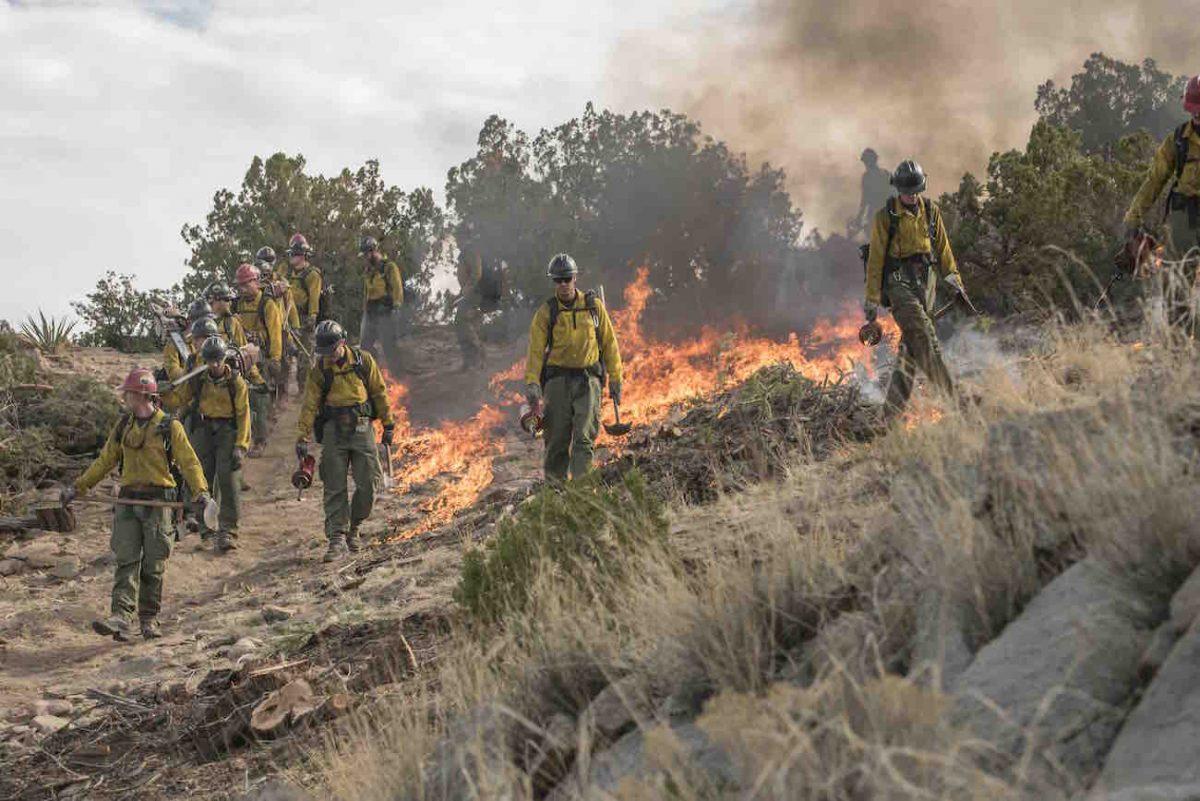 Granite Mountain Hotshots start the back burn at Yarnell Hills in “Only the Brave.” (Columbia Pictures/Richard Foreman/Sony Pictures Entertainment)