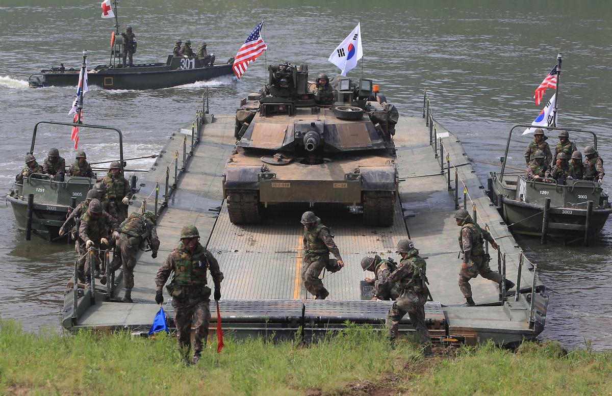 U.S. Army soldiers and a U.S. M1A2 tank and South Korean soldiers participate in a river crossing exercise on May 30, 2013 in Yeoncheon-gun, South Korea. The joint exercise is one of several the two countries have held in recent months. (Chung Sung-Jun/Getty Images)
