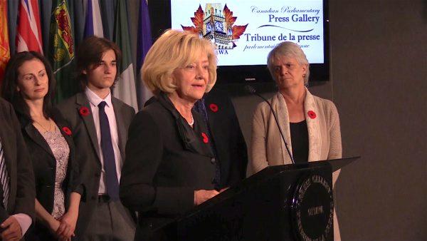 Senator Raynell Andreychuk speaks at a press conference with MP Hélène Laverdière (R), Sergei Magnitsky’s widow Natalia, and their son Nikita in the background in Ottawa on Nov. 1, 2017. (Limin Zhou/NTD Television)