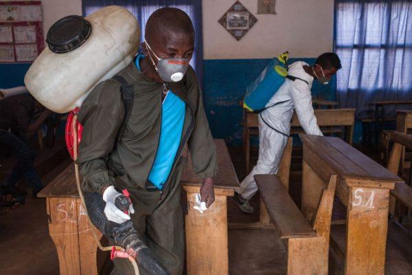 Officers from the Ministry of Health spread pesticide against carriers of the plague such as fleas in a primary school at Andraisoro, a district of the Antananarivo on Oct. 2, 2017. (RijasoloAFP/Getty Images)