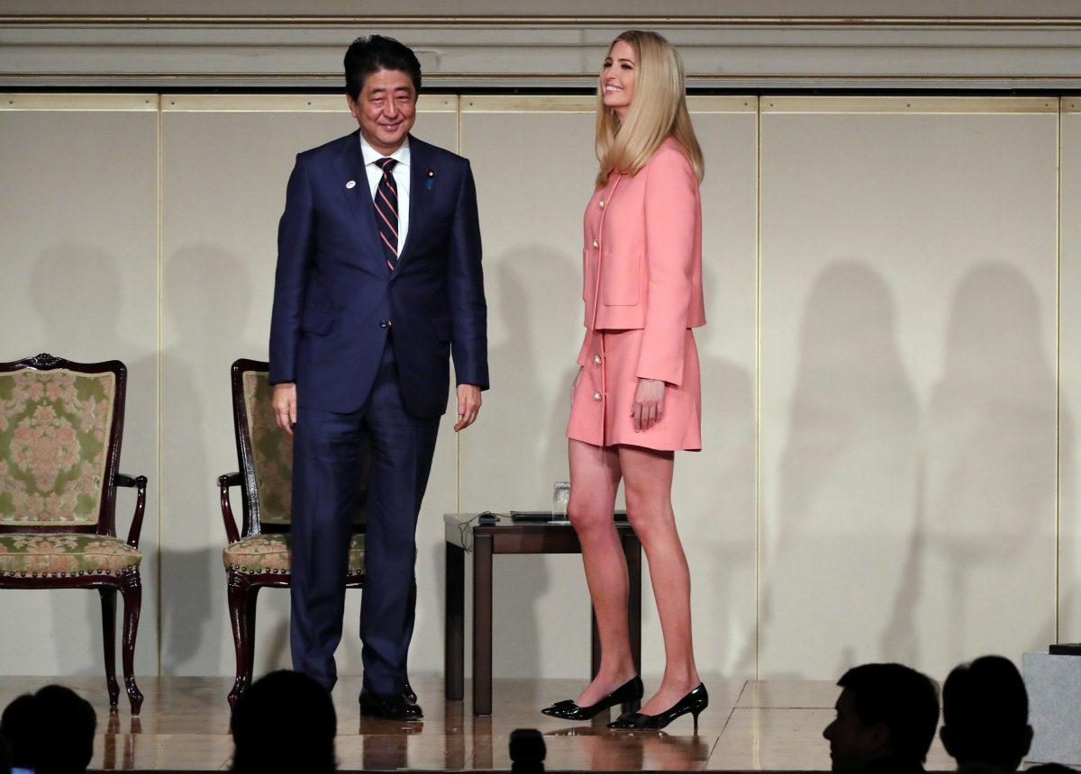 Ivanka Trump, the daughter and assistant to President Donald Trump, right, and Japanese Prime Minister Shinzo Abe, left, stand together at World Assembly for Women: WAW! 2017 conference Friday, Nov. 3, 2017 in Tokyo. (REUTERS/Eugene Hoshiko/Pool)