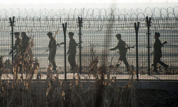 North Korean soldiers patrol next to the border, across from the Chinese border town of Dandong on February 10, 2016. (Johannes Eisele/AFP/Getty Images)