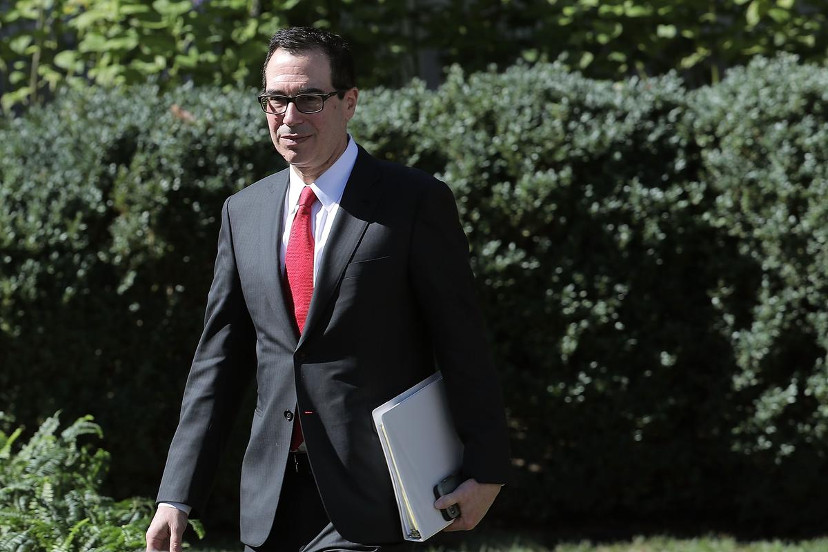 U.S. Treasury Secretary Stephen Mnuchin walks into the Rose Garden for a news conference at the White House October 17, 2017 in Washington, DC. On Nov. 2, Mnuchin announced a China’s Bank of Dandong was cut off from the U.S. financial system. (Chip Somodevilla/Getty Images)
