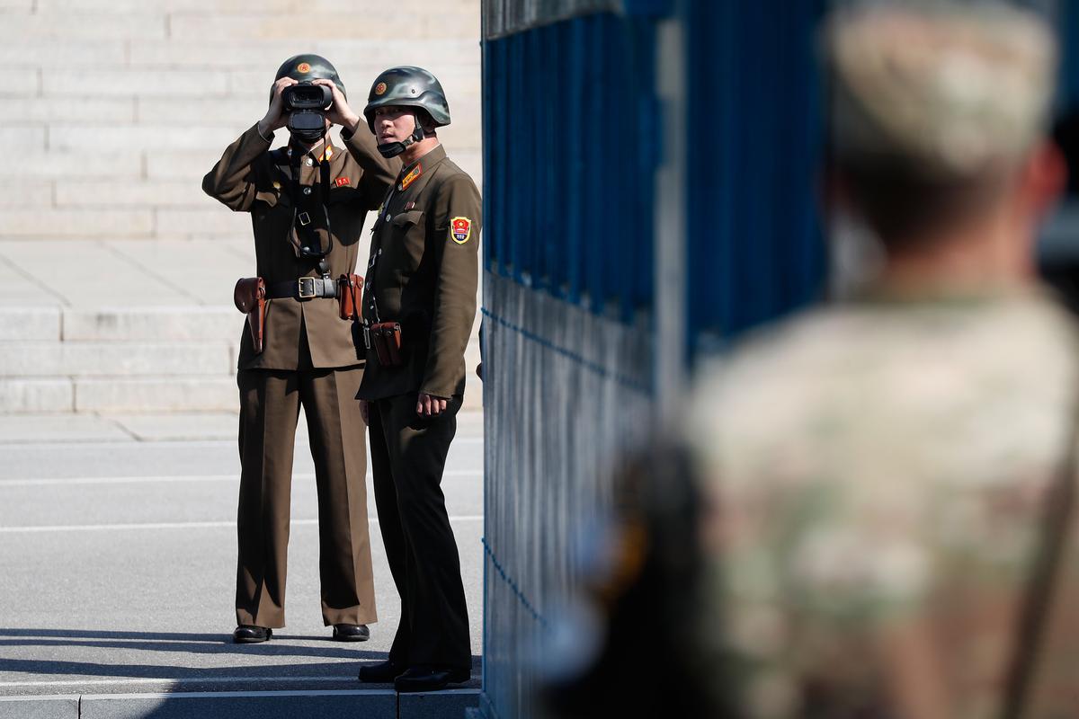 North Korean soldiers look towards South Korea at the truce village of Panmunjom in the Demilitarized Zone (DMZ) on October 27, 2017, in Panmunjom, South Korea. (Jeon Heon-Kyun-Pool/Getty Images)