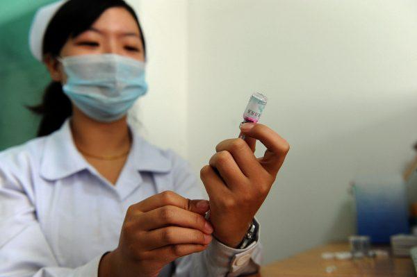 A Chinese nurse prepares a dose of vaccination against measles in Hefei City, on September 11, 2010. (STR/AFP/Getty Images)