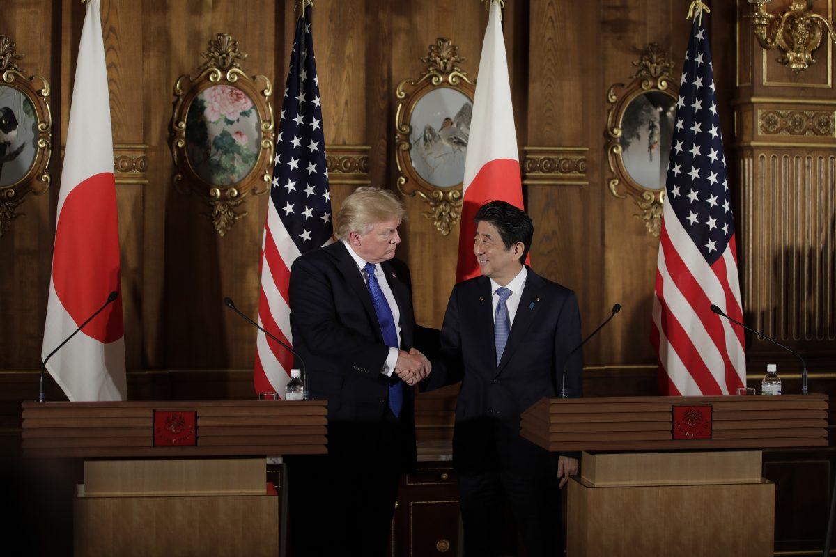 President Donald Trump shakes hands with Japan's Prime Minister Shinzo Abe (R) during a news conference at Akasaka Palace in Tokyo on November 6, 2017. (KIYOSHI OTA/AFP/Getty Images)