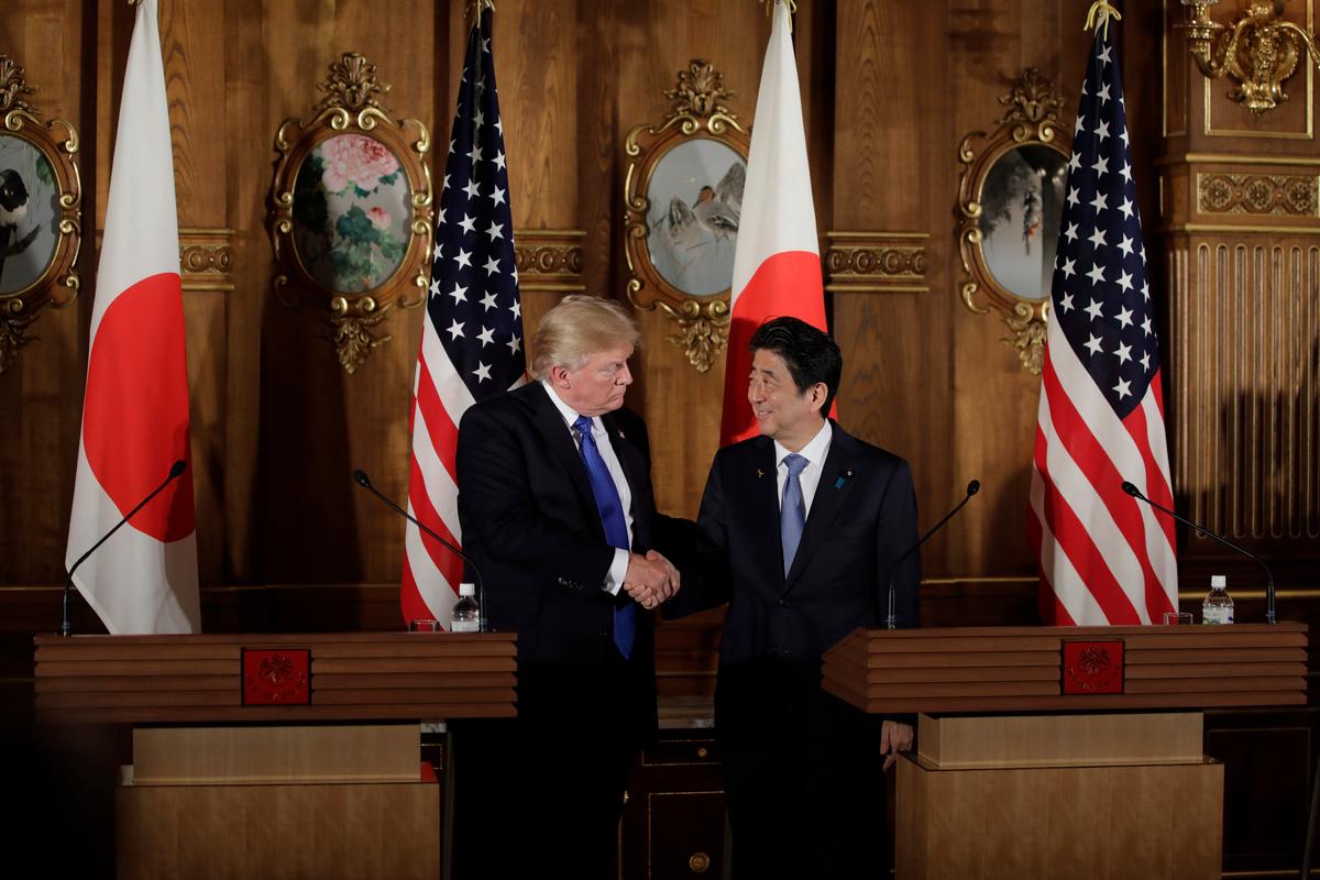 President Donald Trump shakes hands with Japan's Prime Minister Shinzo Abe (R) during a news conference at Akasaka Palace in Tokyo on Nov. 6, 2017. (KIYOSHI OTA/AFP/Getty Images)
