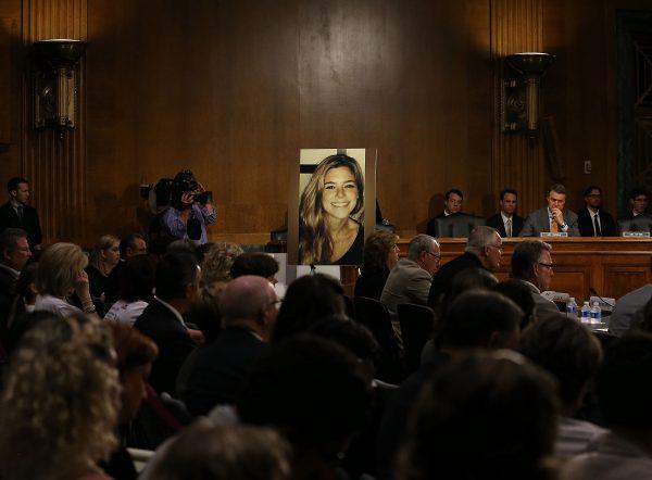 A large photo of Kate Steinle, who was killed by an illegal immigrant in San Francisco, is displayed, while her father, Jim Steinle, testifies at a Senate judiciary committee hearing in Washington on July 21, 2015. (Mark Wilson/Getty Images)