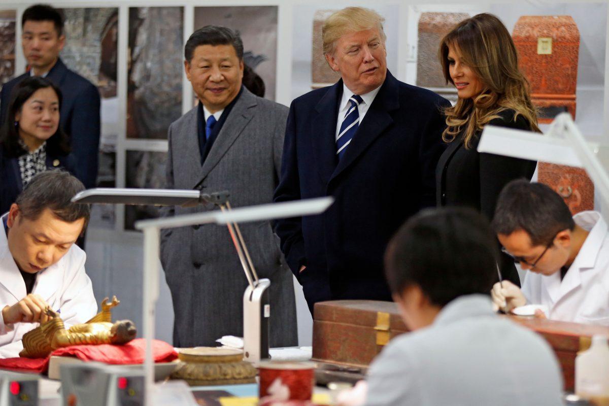 President Donald Trump, First Lady Melania Trump, and China's leader Xi Jinping tour the Conservation Scientific Laboratory of the Forbidden City in Beijing on November 8, 2017.<br/>(ANDY WONG/AFP/Getty Images)