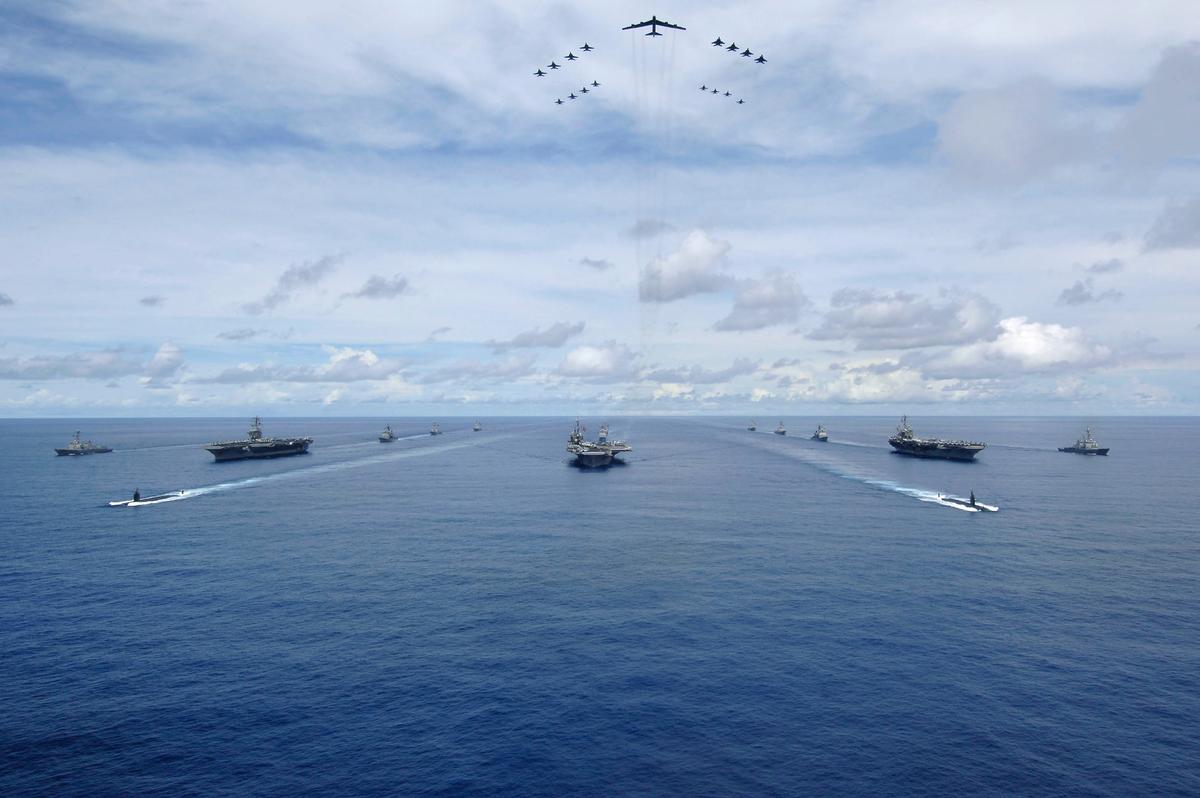 USS Nimitz (CVN 68), USS Kitty Hawk (CV 63), and USS John C. Stennis (CVN 74) carrier strike groups steam in formation during a joint photo exercise (PHOTOEX) during the Valiant Shield exercise on Aug.14, 2007.