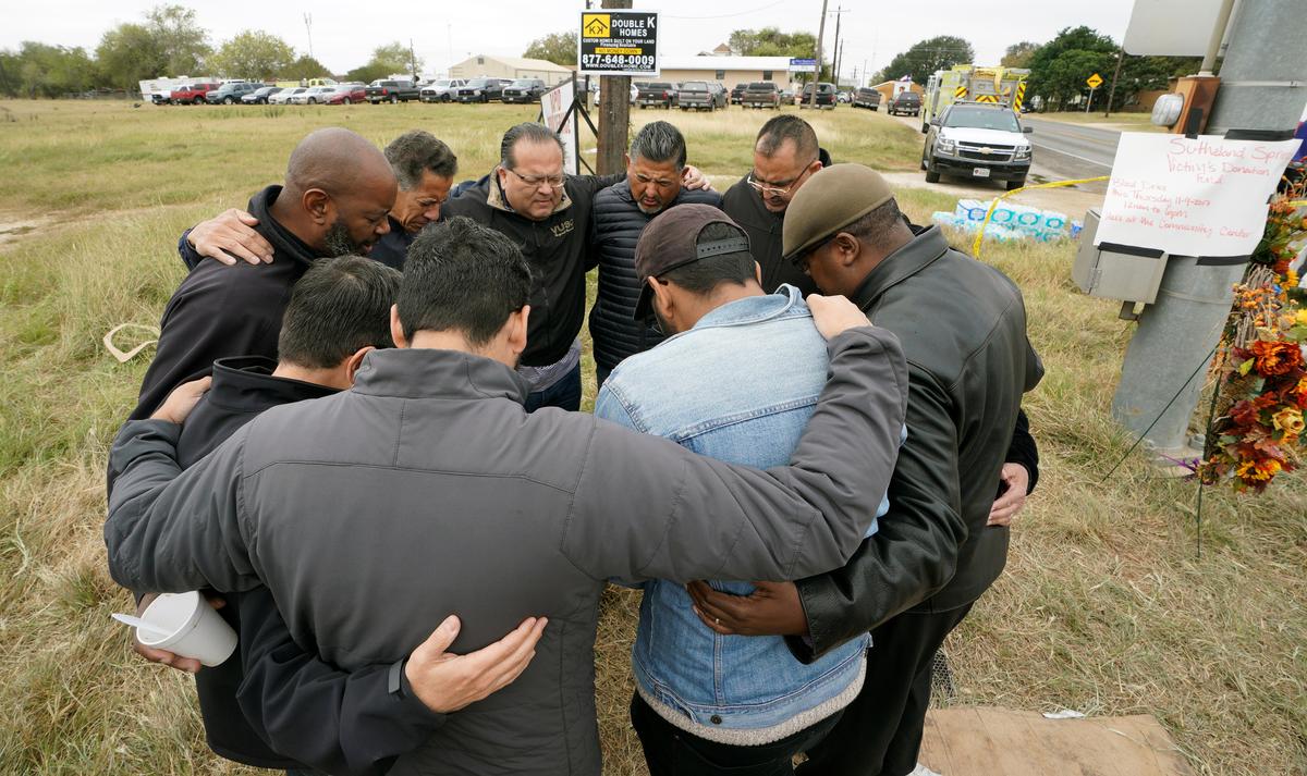 South Texas pastors pray at the site of the First Baptist Church shooting in Sutherland Springs, Texas. (REUTERS/Rick Wilking)