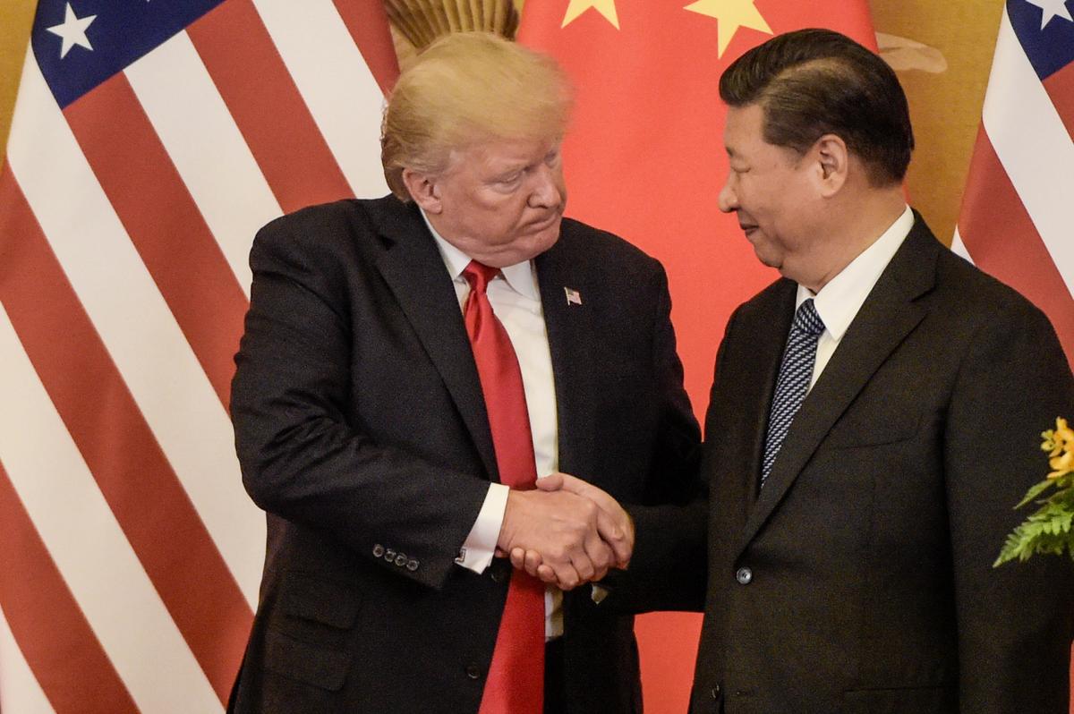 Trump shakes hand with Xi at the end of a press conference at the Great Hall of the People in Beijing on November 9, 2017. (Fred Dufour/AFP/Getty Images)