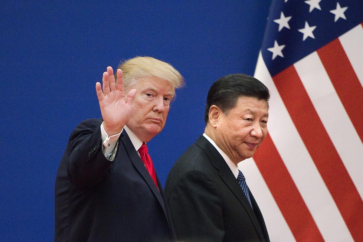 Trump and Xi leave a business leaders event at the Great Hall of the People in Beijing on November 9, 2017. (Nicolas Asfouri/AFP/Getty Images)