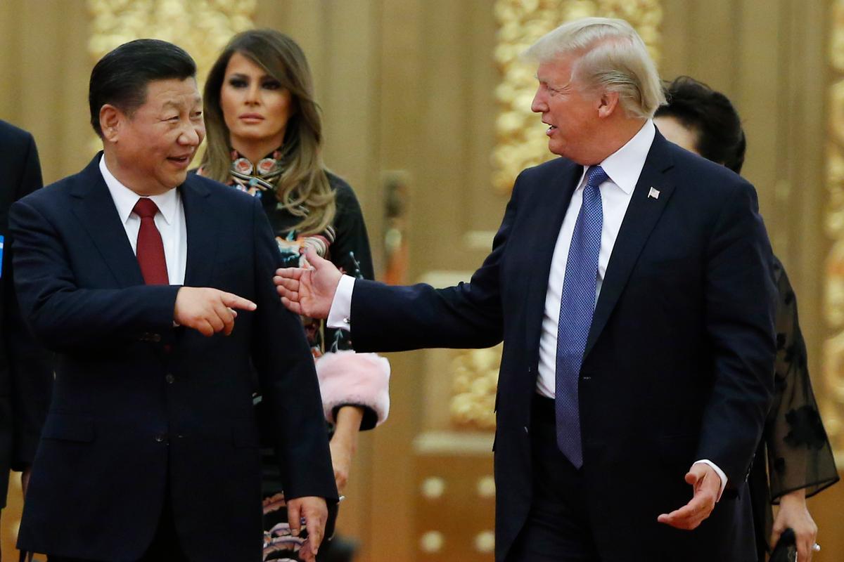 President Donald Trump and China's leader Xi Jinping arrive at a state dinner at the Great Hall of the People on Nov. 9, 2017, in Beijing. (Thomas Peter - Pool/Getty Images)