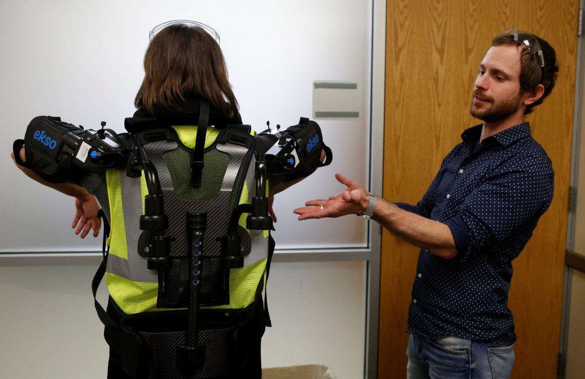 Ford Motor Co ergonomic Marty Smets talks about the exoskeletal technology EksoVest being tested at Wayne Assembly plant in Wayne, Michigan, U.S., Nov. 9, 2017. (REUTERS/Rebecca Cook)