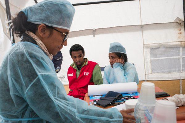 Doctors and nurses from The Ministry of Health and officers of the Malagasy Red Cross staff a healthcare checkpoint at the "taxi-brousse" station of Ampasapito district in Antananarivo, Madagascar, on Oct. 5, 2017. (RIJASOLO/AFP/Getty Images)